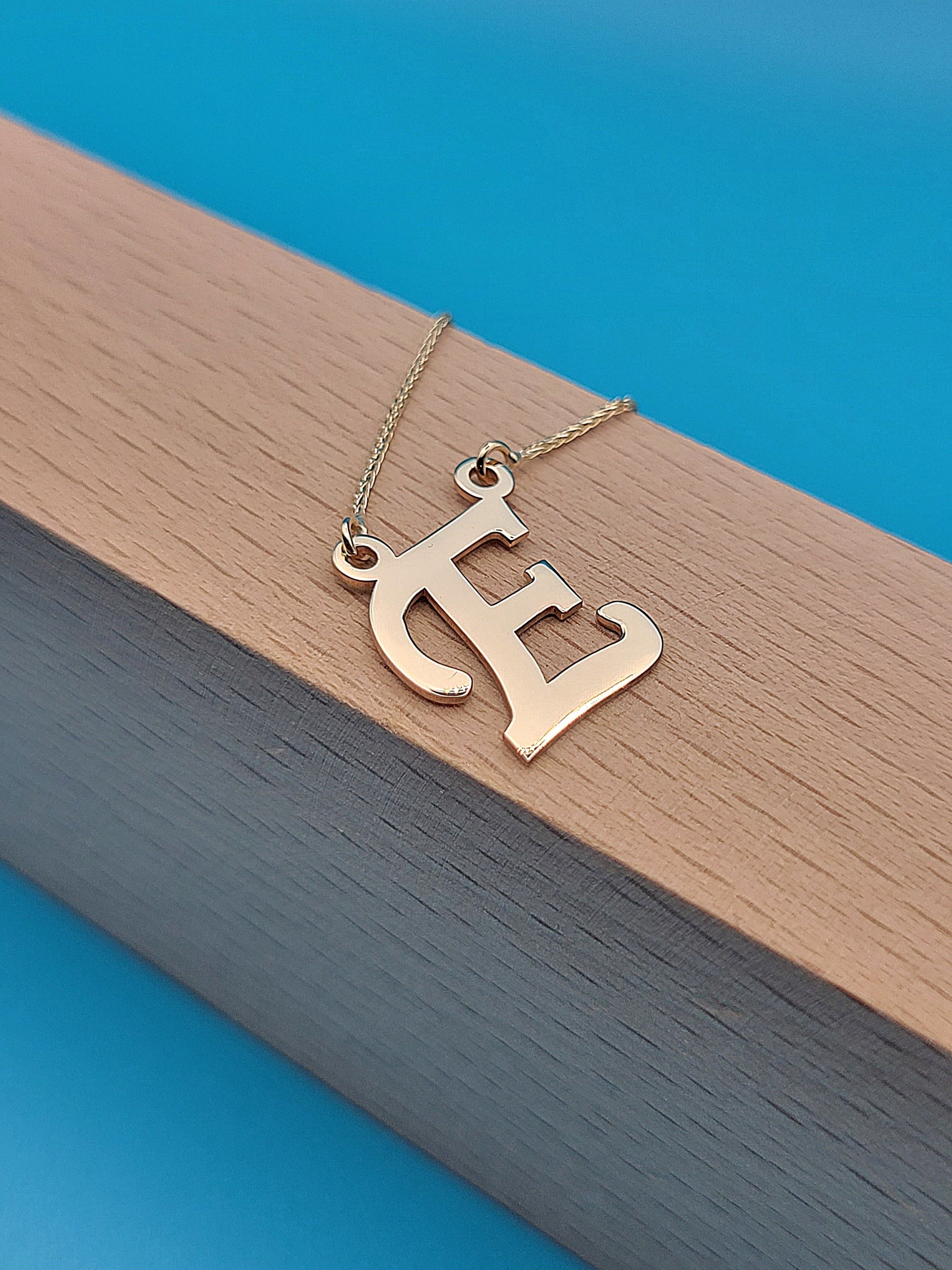 Slide 4of5: Beautiful necklace with capital letter initial "E" in 14k Yellow Gold